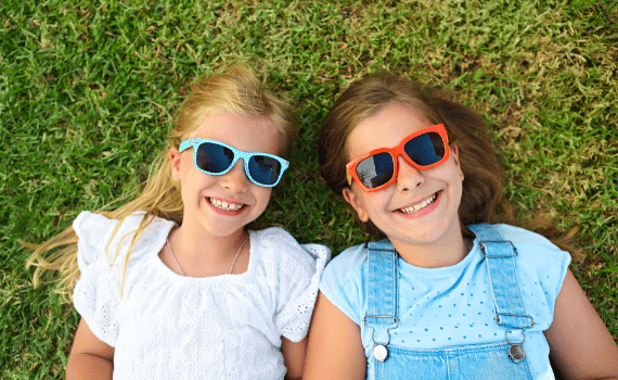 Children Wearing Sun Glasses To keep Safe From The Sun